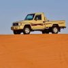 Pick Up Truck On The Desert Dunes Under A Blue Sky paint by numbers