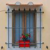 Window With Iron Guards On Yellow Building paint by numbers