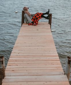 Young Woman Sitting On A Dock Looking Out To Water paint by numbers